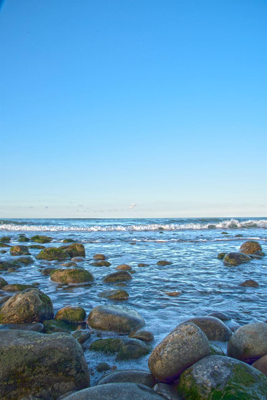 Rocks by a calm blue sea